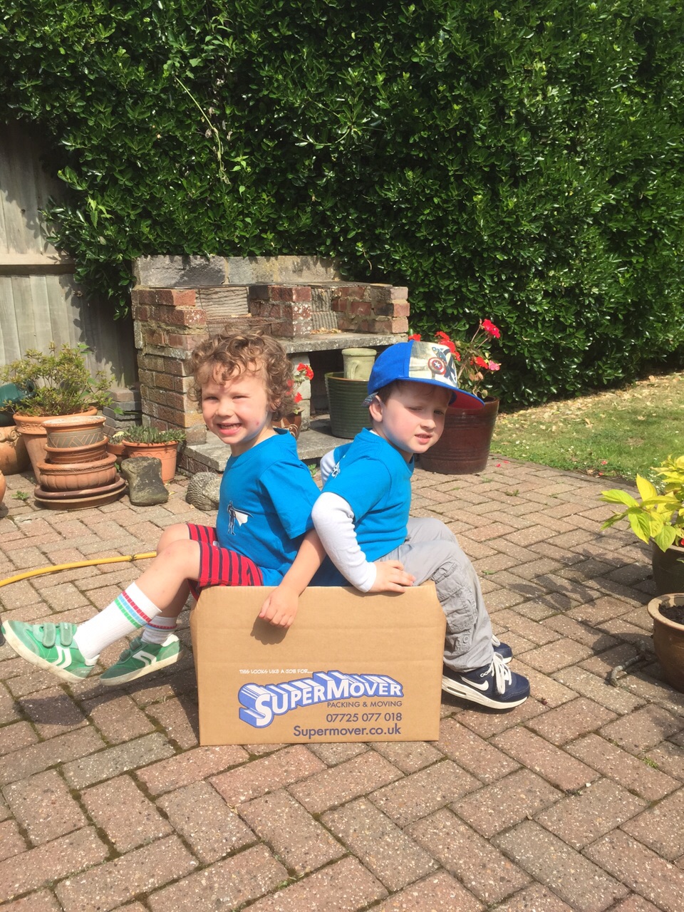 The MiniMovers testing the strength of a book box